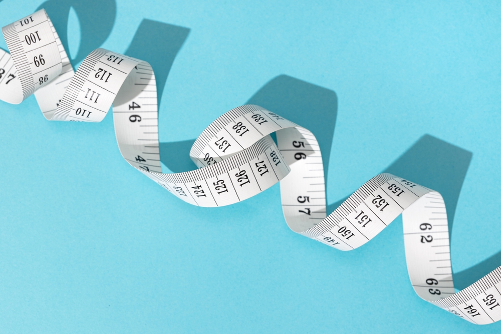 A tape measure coiled up