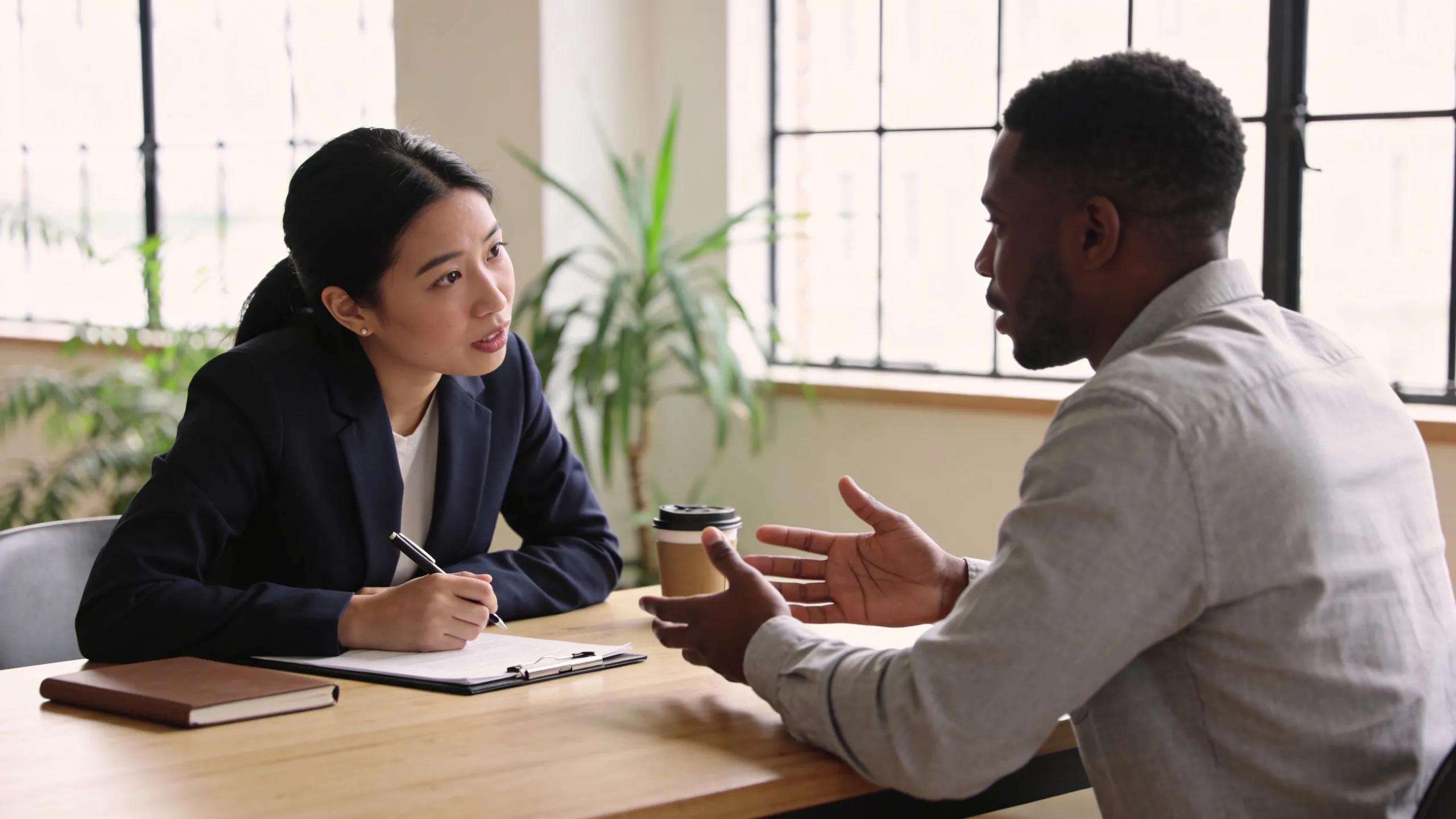 Interviewers assessing fractional CMO candidates and evaluating strategic marketing perspectives.